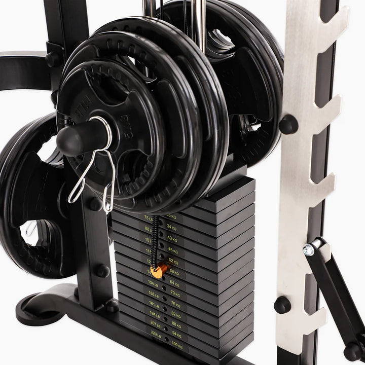 Smith machine with weight plates and adjustable weights for effective training at home or gym in Vancouver.