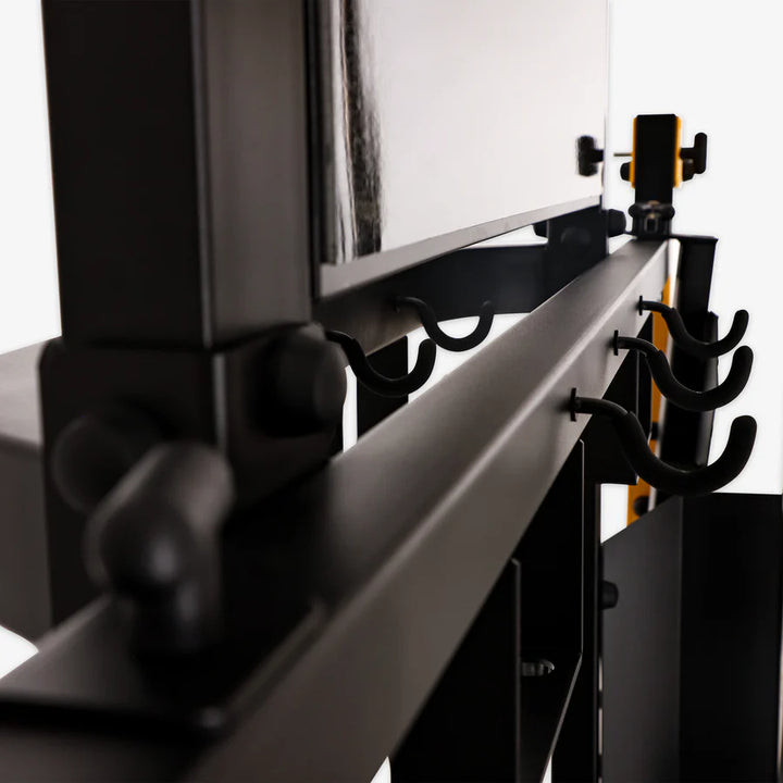 Close-up of Altas Strength Smith Machine hooks for organized weightlifting gear in Vancouver's top fitness store.